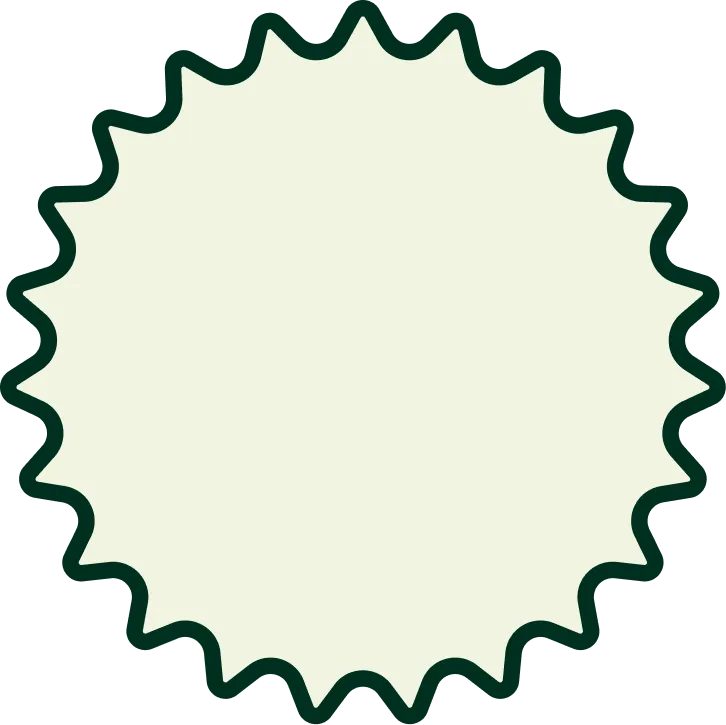 Light beige circular badge with a dark green wavy border resembling a seal or starburst shape.